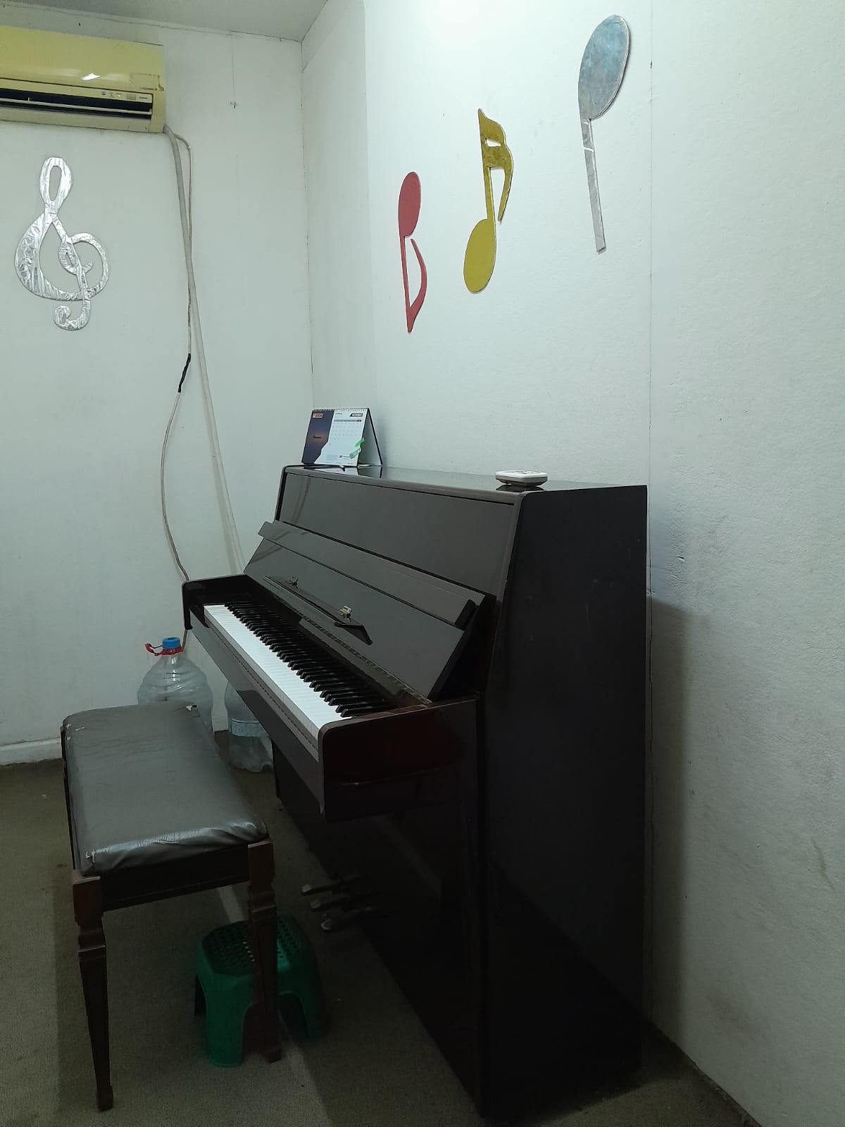 Close-up of a piano with the brand name 'Ritmuller' on it